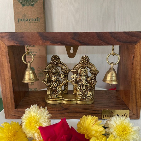 PujaCraft Brass Ganesha And Lakshmi Idol With Wooden Frame ( Width: 9cm, Height: 7cm, Weight: 405 Grams )